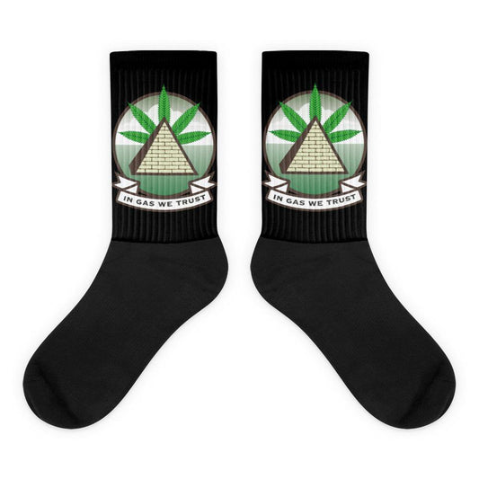 Black socks with In Gas We Trust logo printed on side
